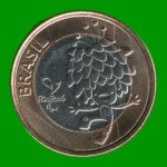 MONEDA DE BRASIL 1 REAL, CONMEMORATIVA MASCOTA TOM, AÑO 2016, ESTADO USADA.-